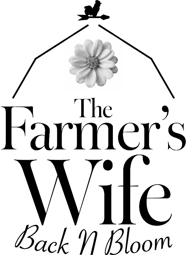 Early floral shop logo concept with flower and barn roof